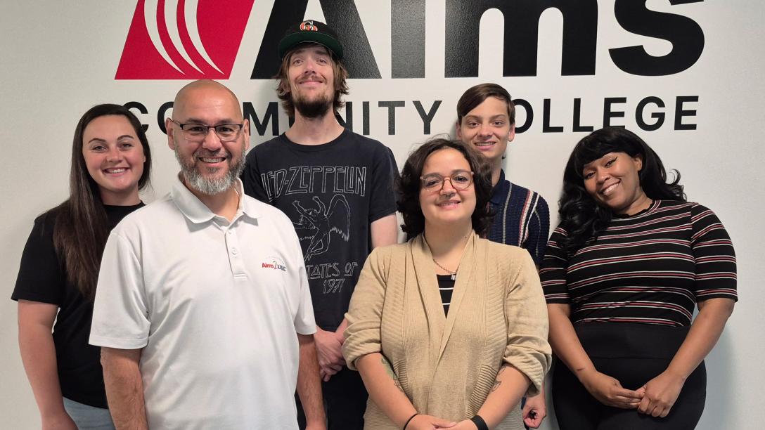 2025 Student Government Administration standing in front of the Aims logo.
