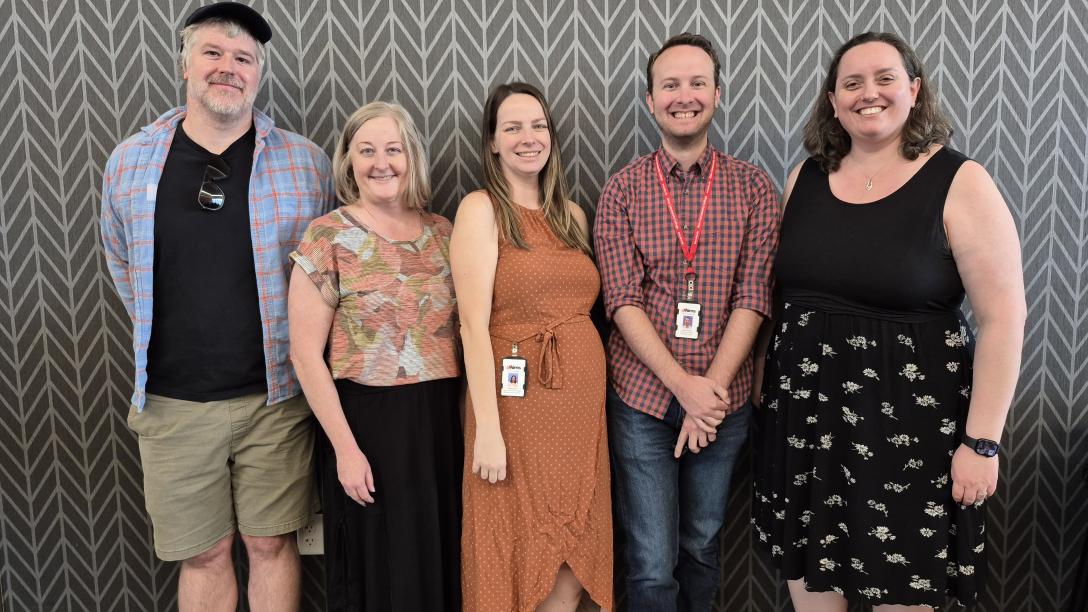 Some of the Civic Engagement Council members standing and smiling together.