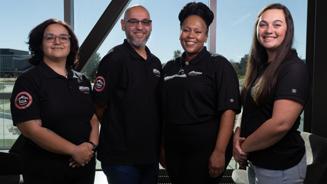 2025 Student Government Administration standing in uniform in front of a window.