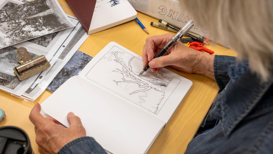 Continuing Education personal enrichment student drawing in a notebook