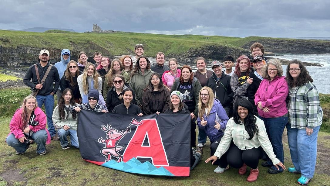 Study Abroad Group with Aims flag