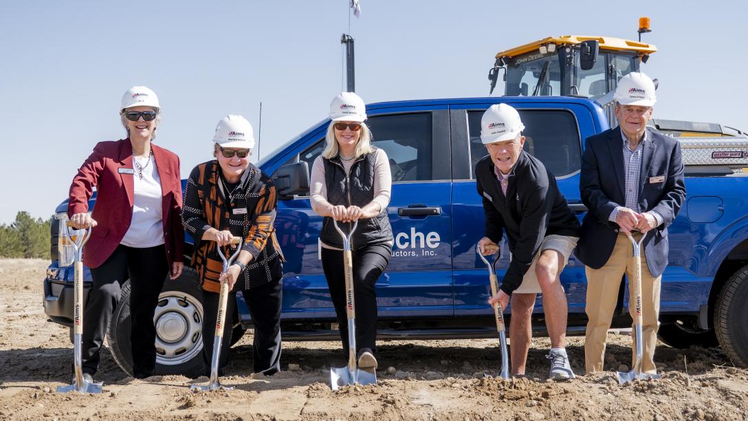 People with shovels at groundbreaking ceremony