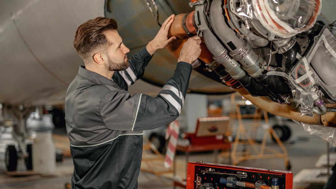 man repairing an airplane