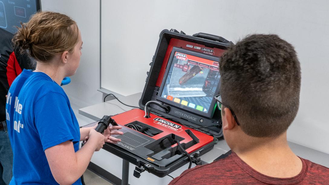Student using welding simulator