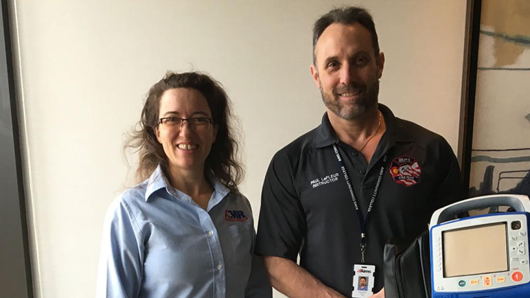 Two people with Zoll Cardiac Monitor
