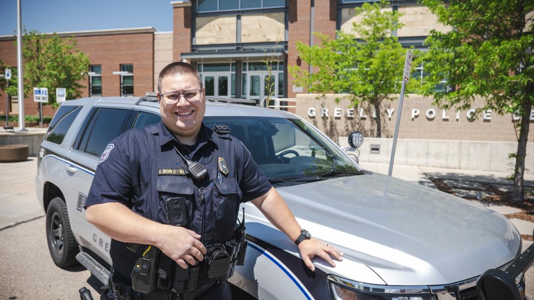 Andrew Brown at Greeley Police Department with Police SUV