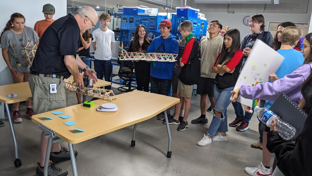 BEST Camp Bridge Building competition - students watching