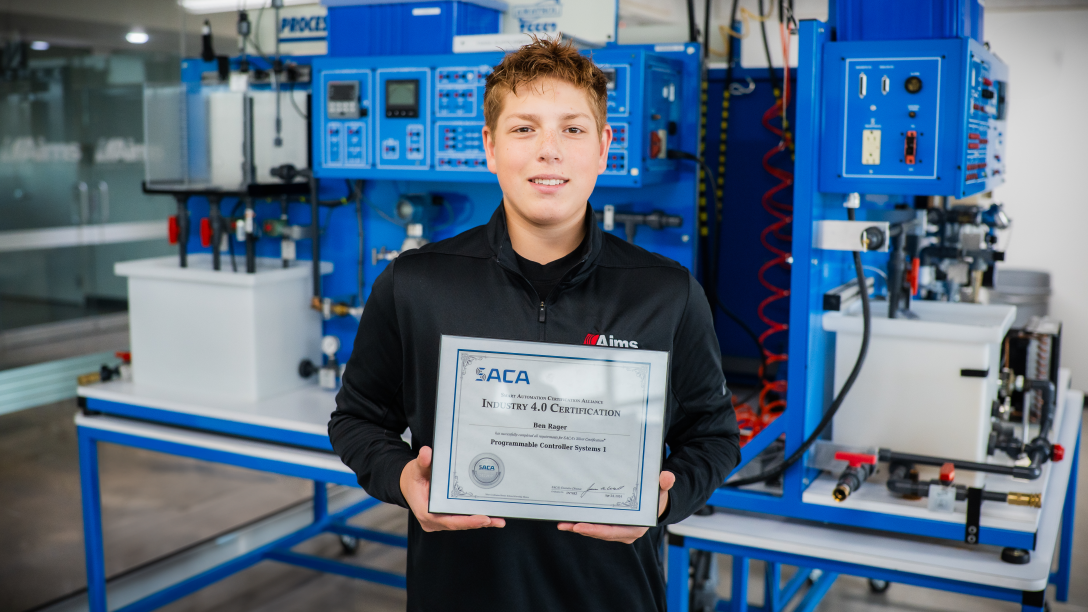 Ben Rager holding SACA certificate at the ATTC lab