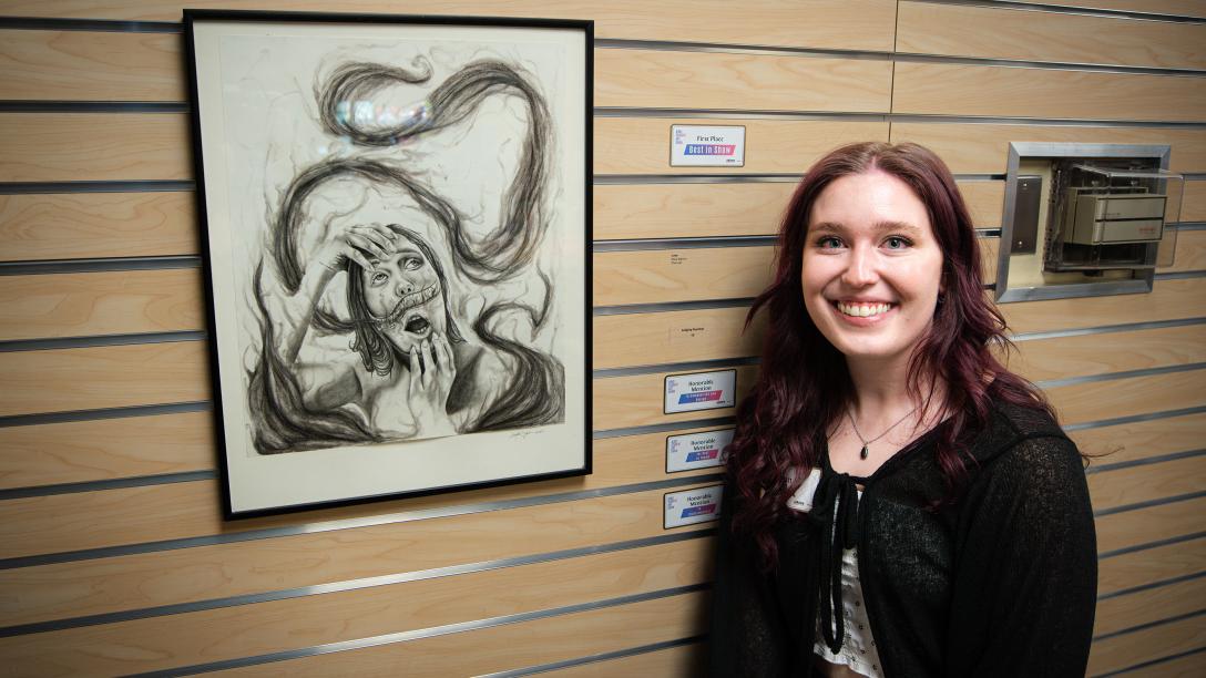 Kayla Sigmon with her art