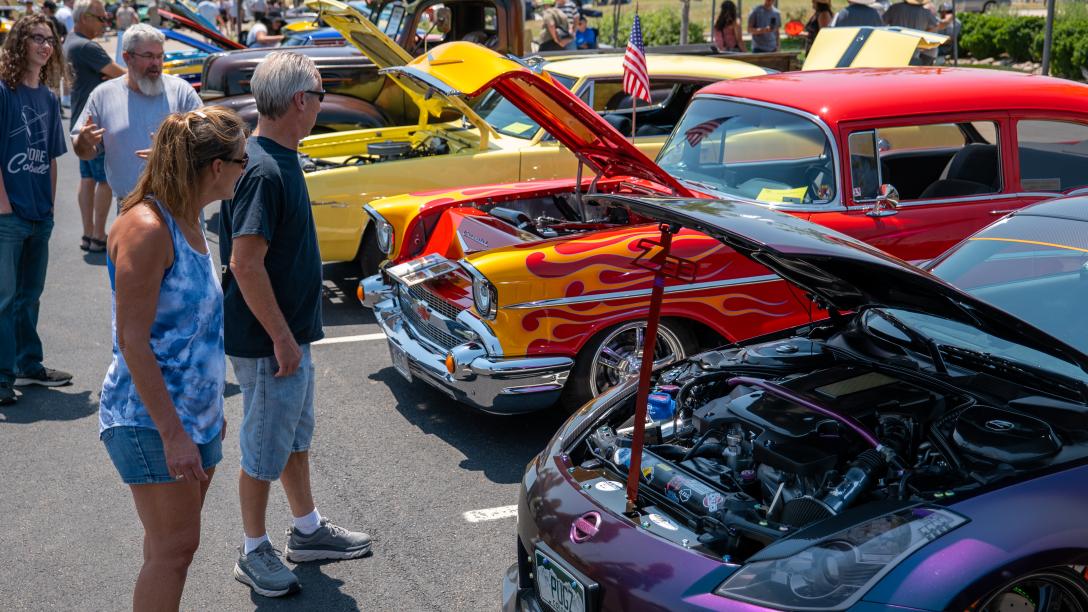 People looking at cars at the 2021 Aims Car Show in Windsor