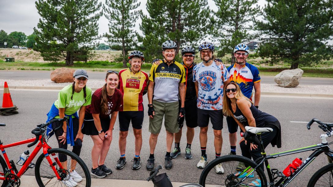people standing in front of bikes