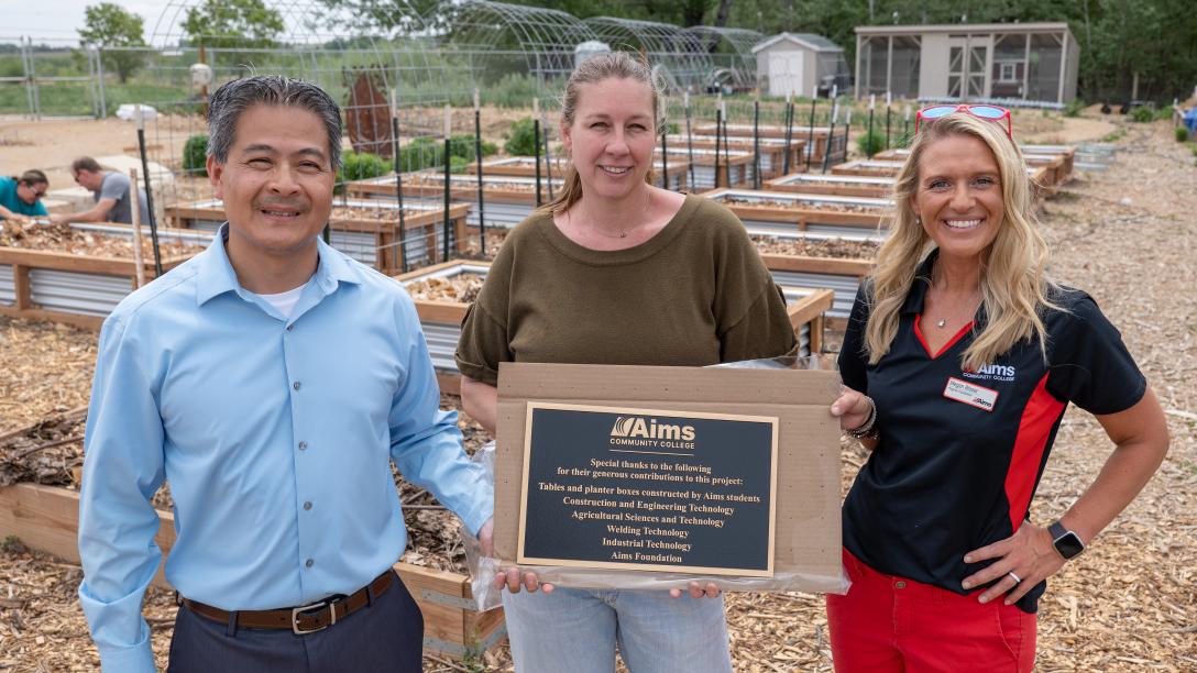 Plaque presentation at the Loveland Youth Gardeners, left to right Phong Tram, Jessica Morgan, and Megan Blaser.