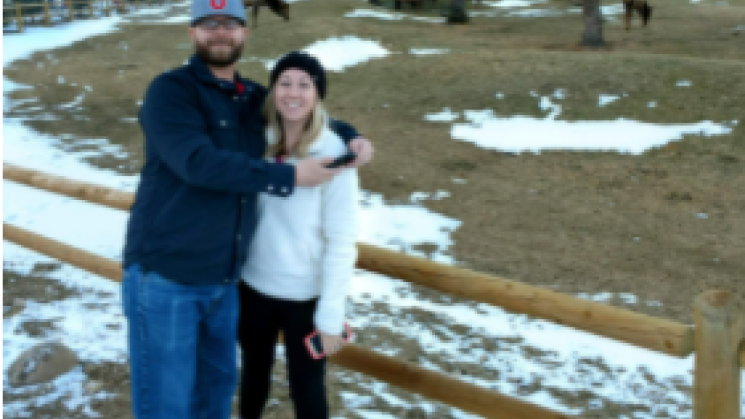 Jared Arellano and woman in front of elk