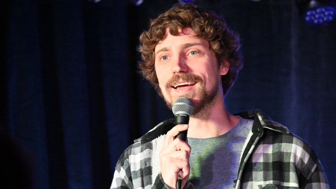 Von Sprecken speaking into a microphone