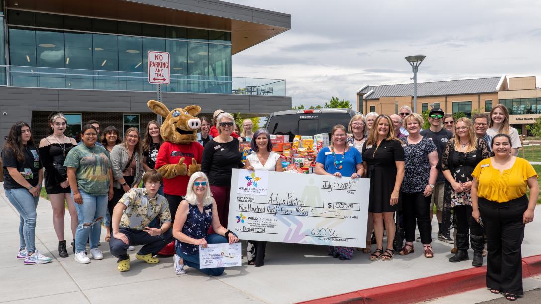 Arty's Pantry Large Check with Group of Employees and Students