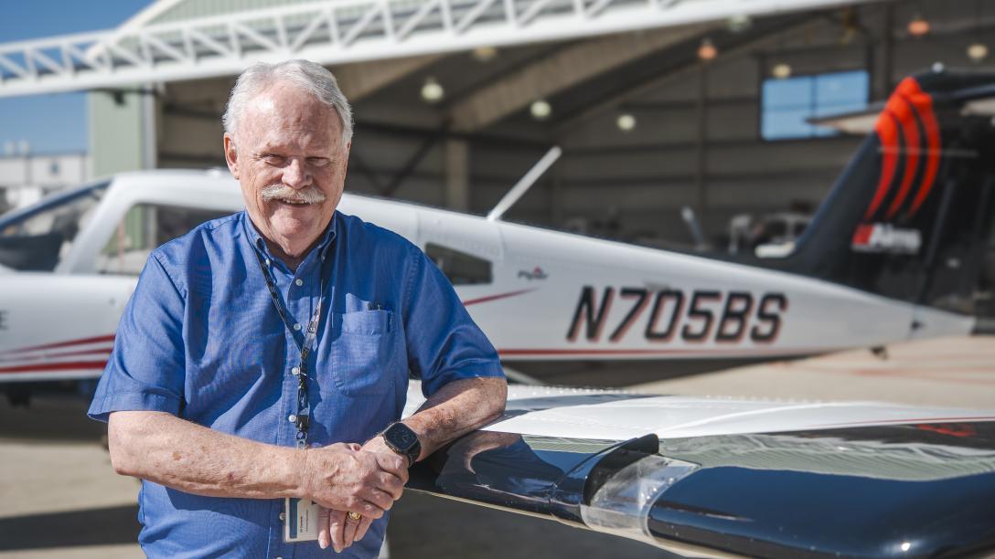 William Standerfer with Airplane at Aims