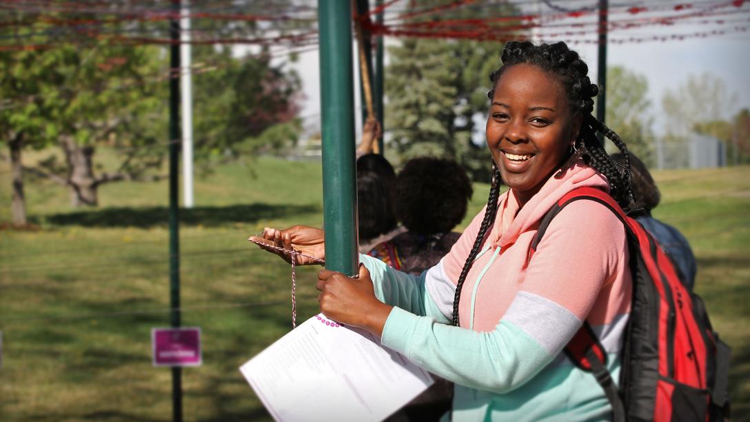 An Aims student smiling during a SAIL unity event