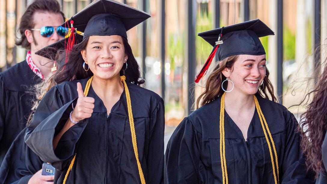 Aims Community College graduates walking during commencement