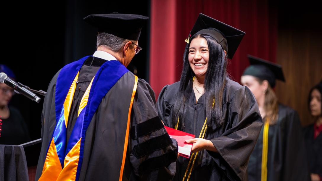 Aims Student getting diploma