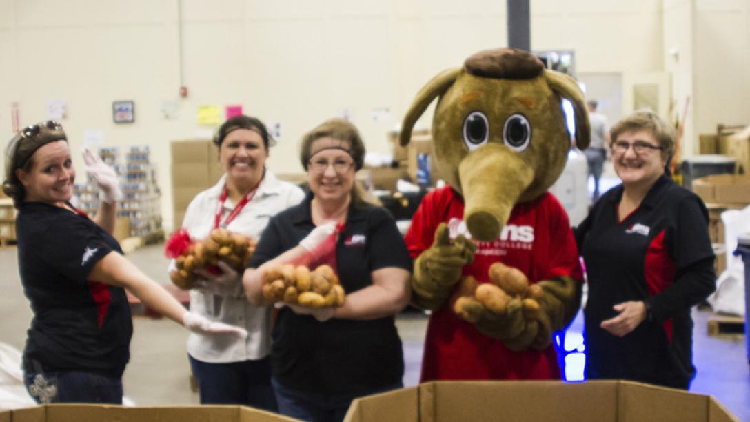 People holding food at food bank