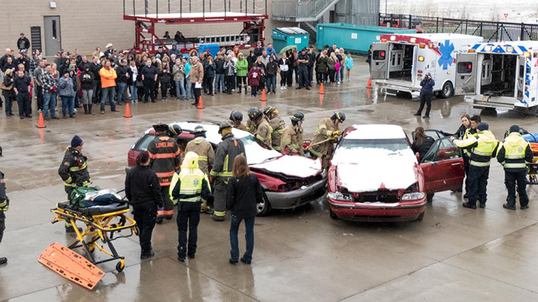 Safety personnel standing around two vehicles
