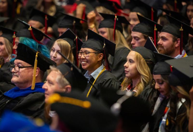 Students in cap and gown regalia for the Spring 2024 Commencement Ceremony at Aims Community College