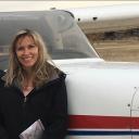 Jennifer Webb in front of plane