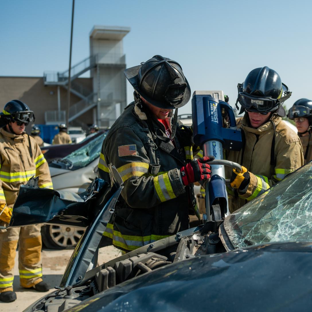 Students used power tools to cut apart a car during an extrication exercise.