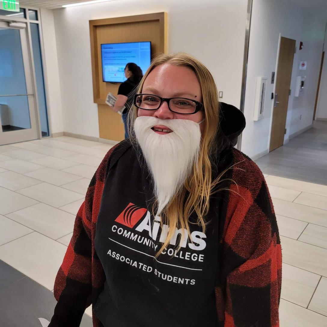 Danielle wearing a fake white beard.