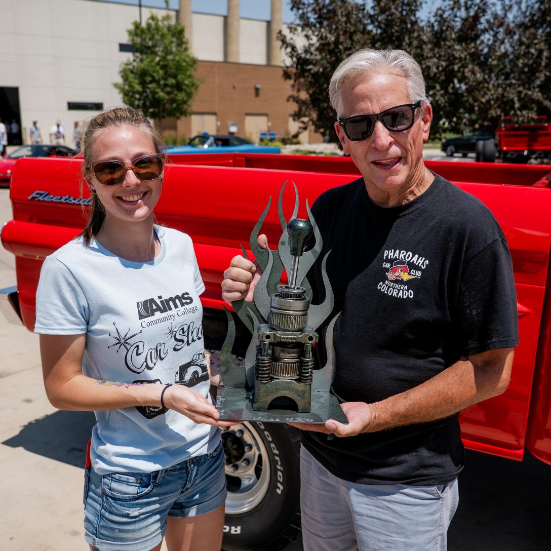 Student and Winner of Car Show Award with Trophy
