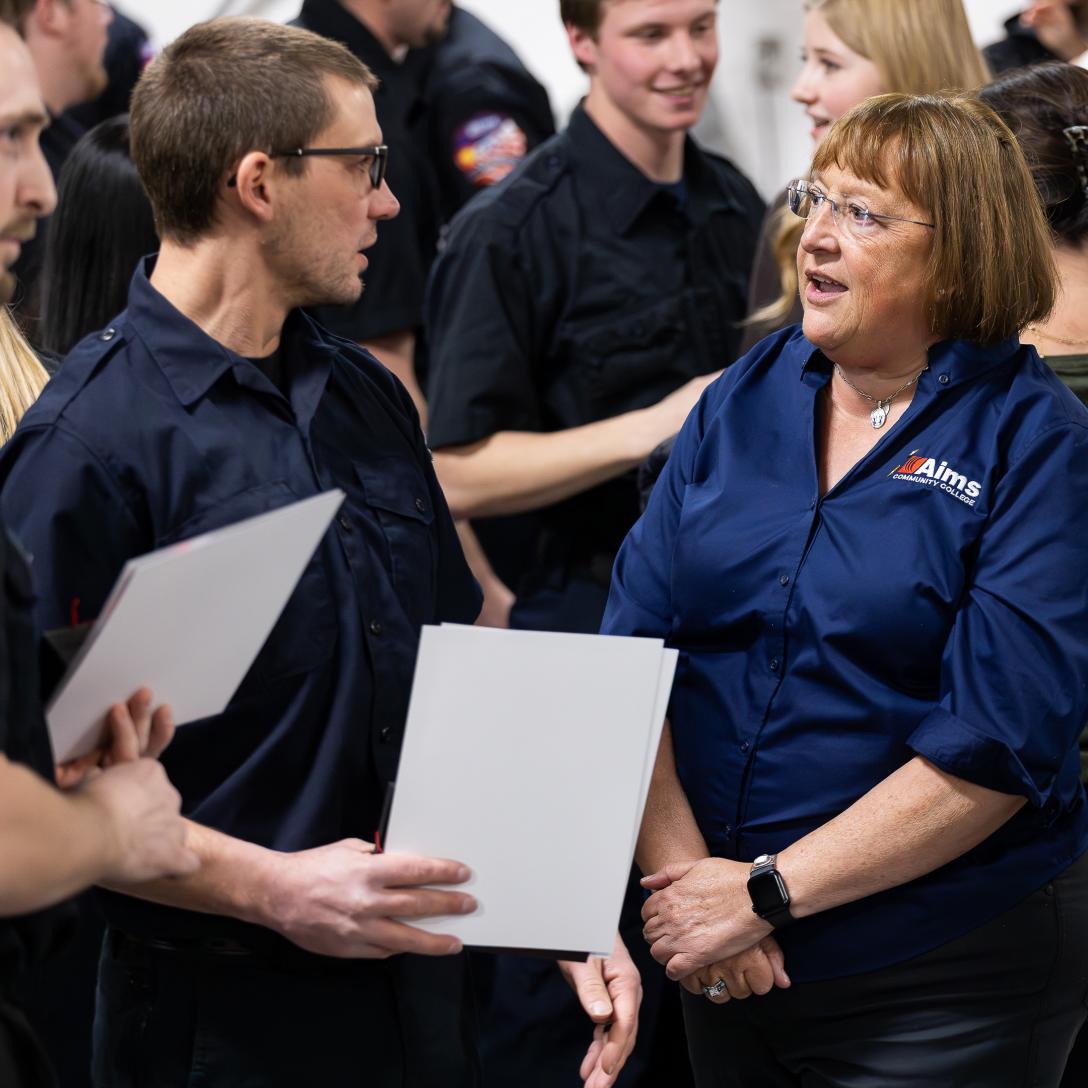 Kristie Skala with student at paramedic graduation