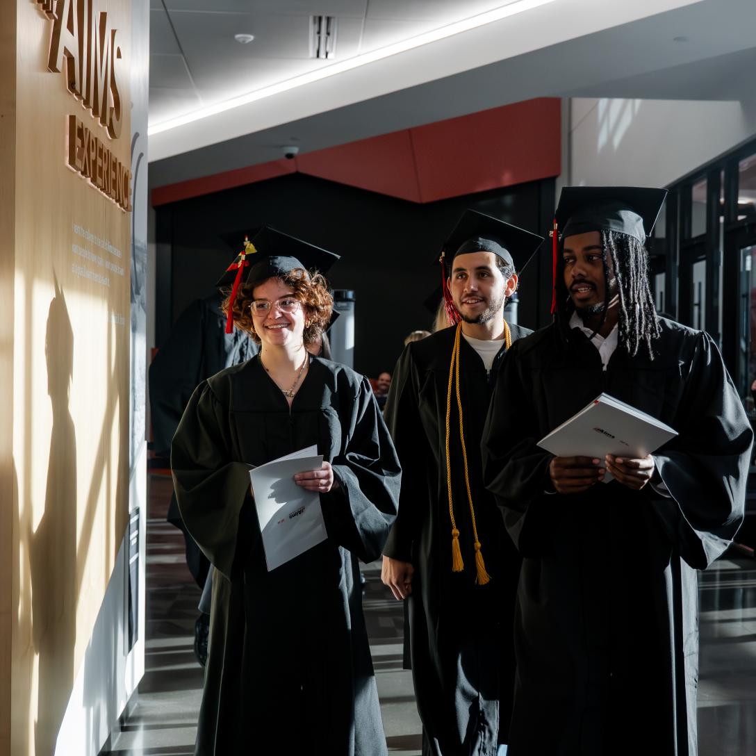 Grads Walking into Commencement at the Welcome Center