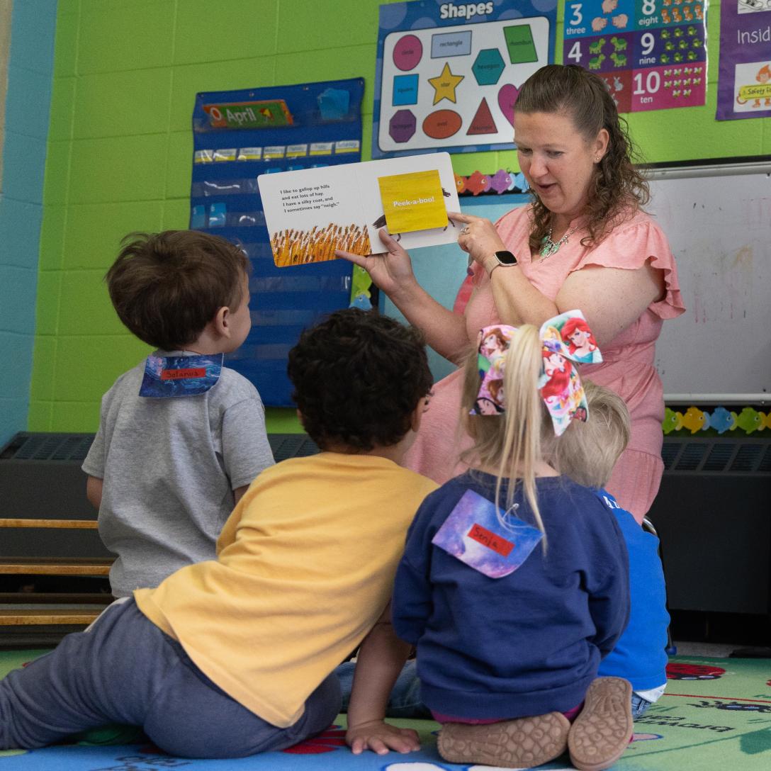 Hannah Copeland reading to preschool students