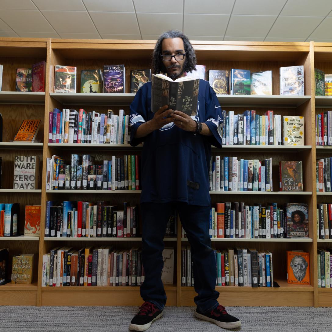 Jeremiah Oatman in Library with poetry book