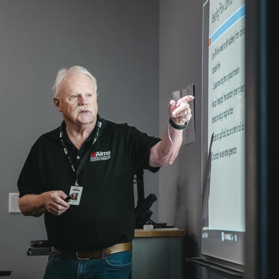 William Standerfer in front of a class