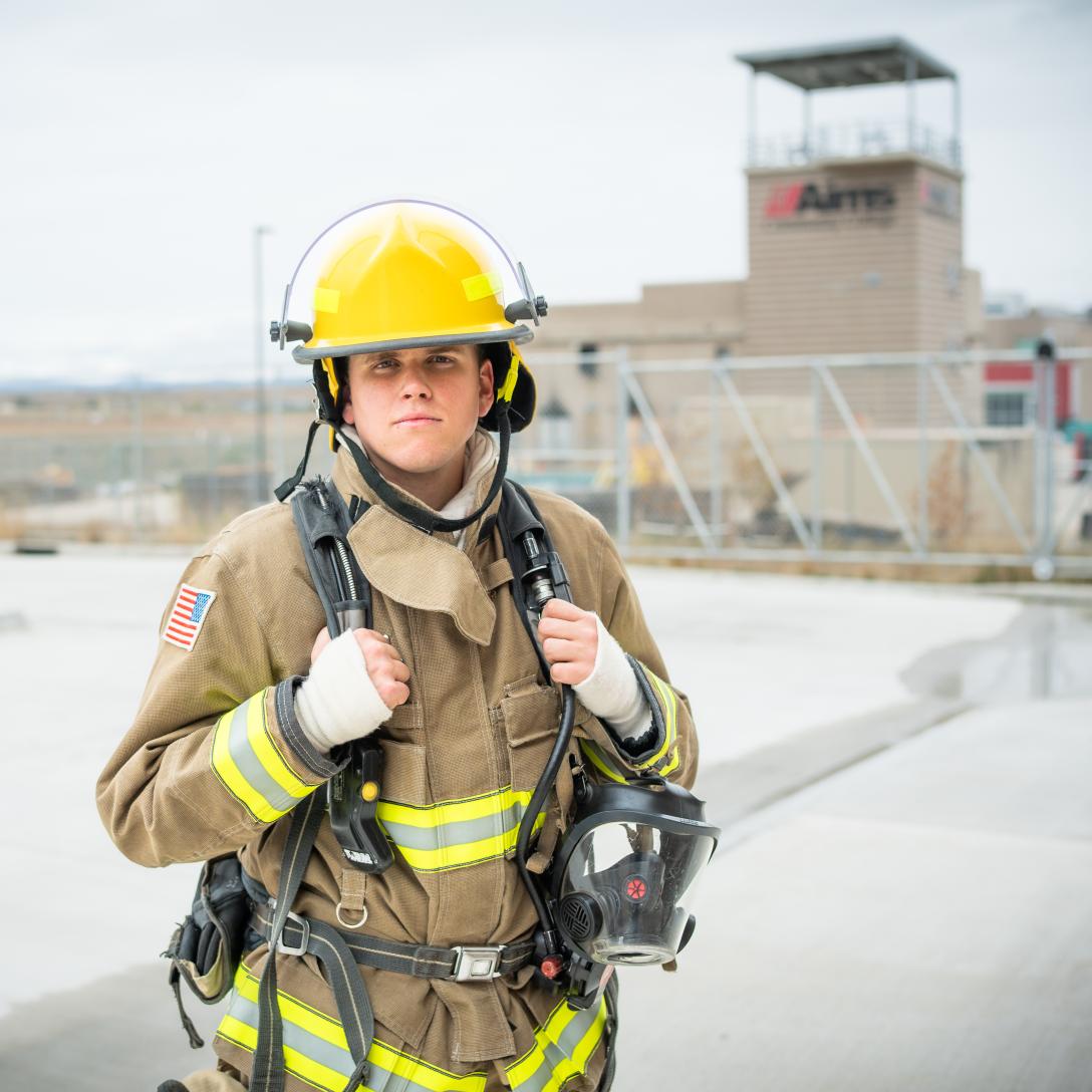Tobi Howell in fire bunker gear