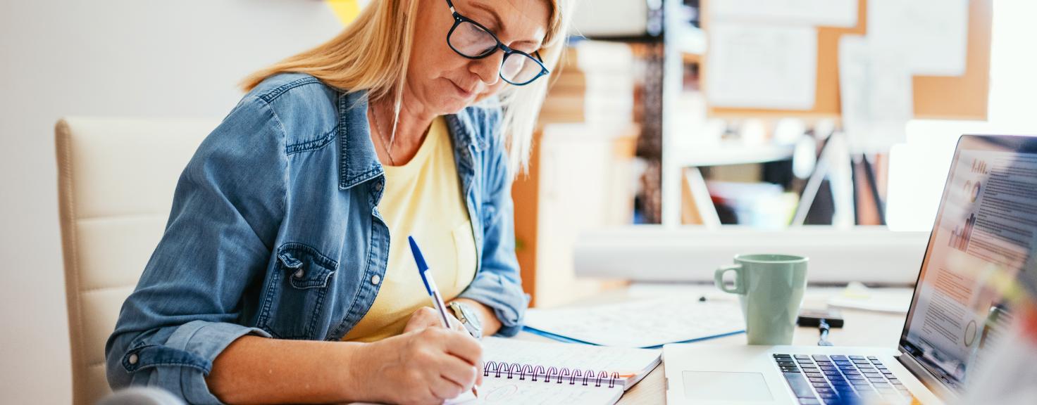 Woman working from home on laptop.