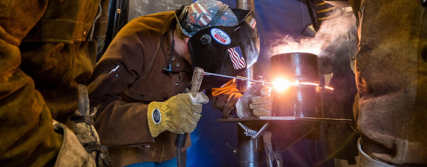 Aims students practicing welding