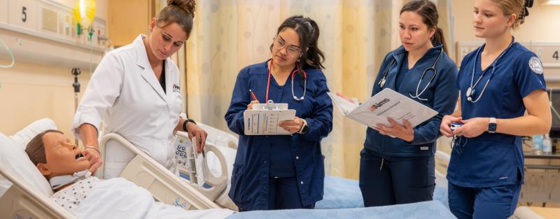 Aims Community College nursing associate degree students working together on a lab exercise