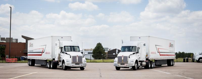 Landscape picture of two trucks