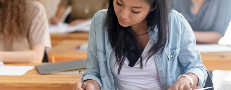 Media Writing student working on paper