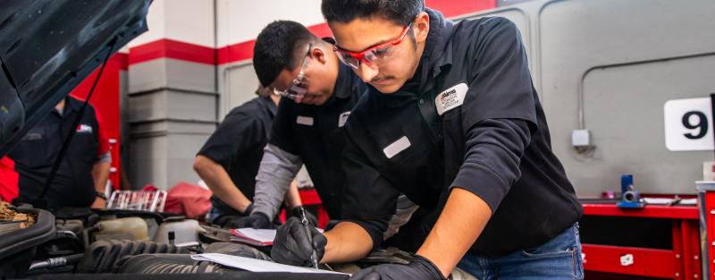 Aims automotive students work on a vehicle