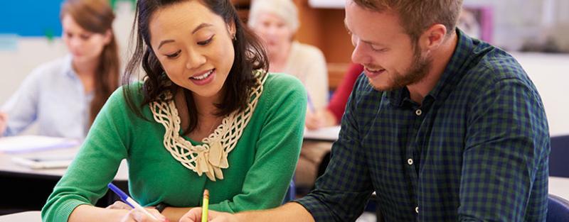 An Aims GED student getting help from an instructor.