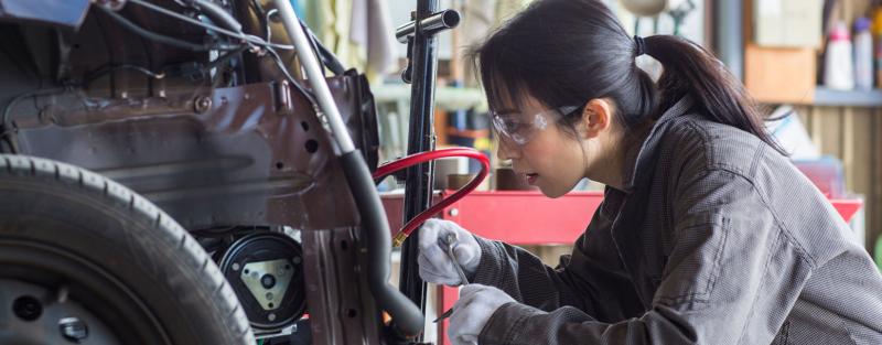 Automotive Collision Repair Technology student working on a car