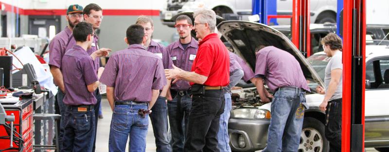 Students chat during an automotive class at Aims Community College 