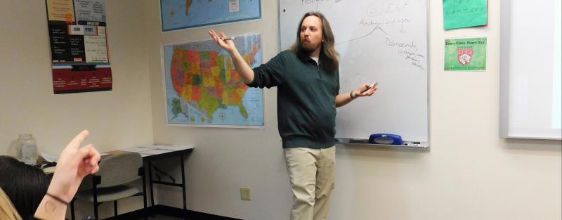 Political Science instructor teaching in the classroom at Aims