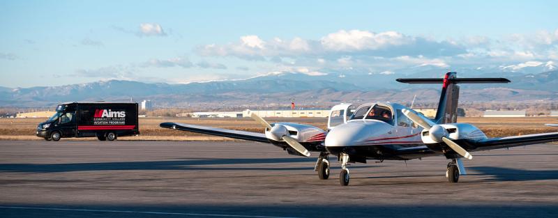 An Aims professional pilot student engaged in flight practice in an airplane