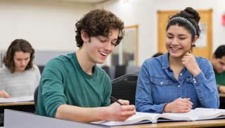 Students working together in class at Aims Community College