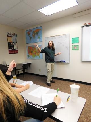 Political Science instructor teaching in the classroom at Aims
