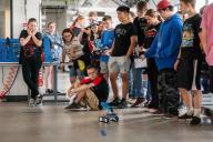 BEST Camp Robotic competition, student watching robot in action